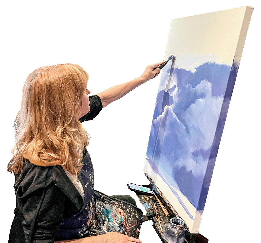 Darcie Kent painting blue and white clouds on a large canvas