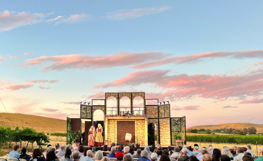 Shakespeare in the Vineyards: a stage set up and players acting in "Much Ado About Nothing"