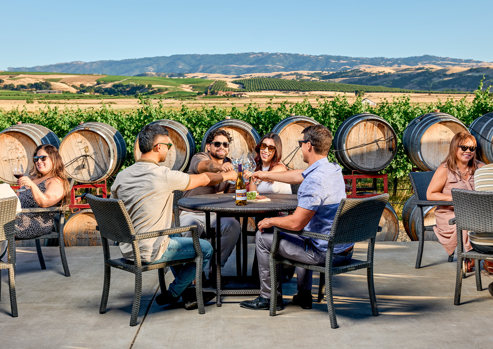 Group of people tasting on the outdoor pad of Bing's Barn